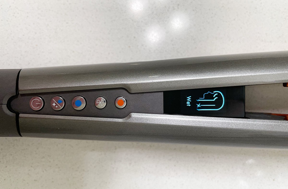 a Dyson hair straightener with the mode &quot;wet&quot; on