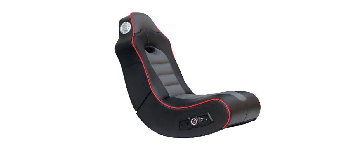 black rocker style gaming chair with red trim on white background