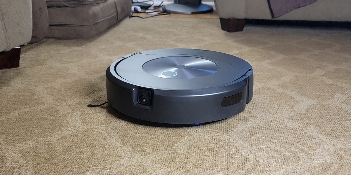 Robot vacuum vacuuming light beige carpet