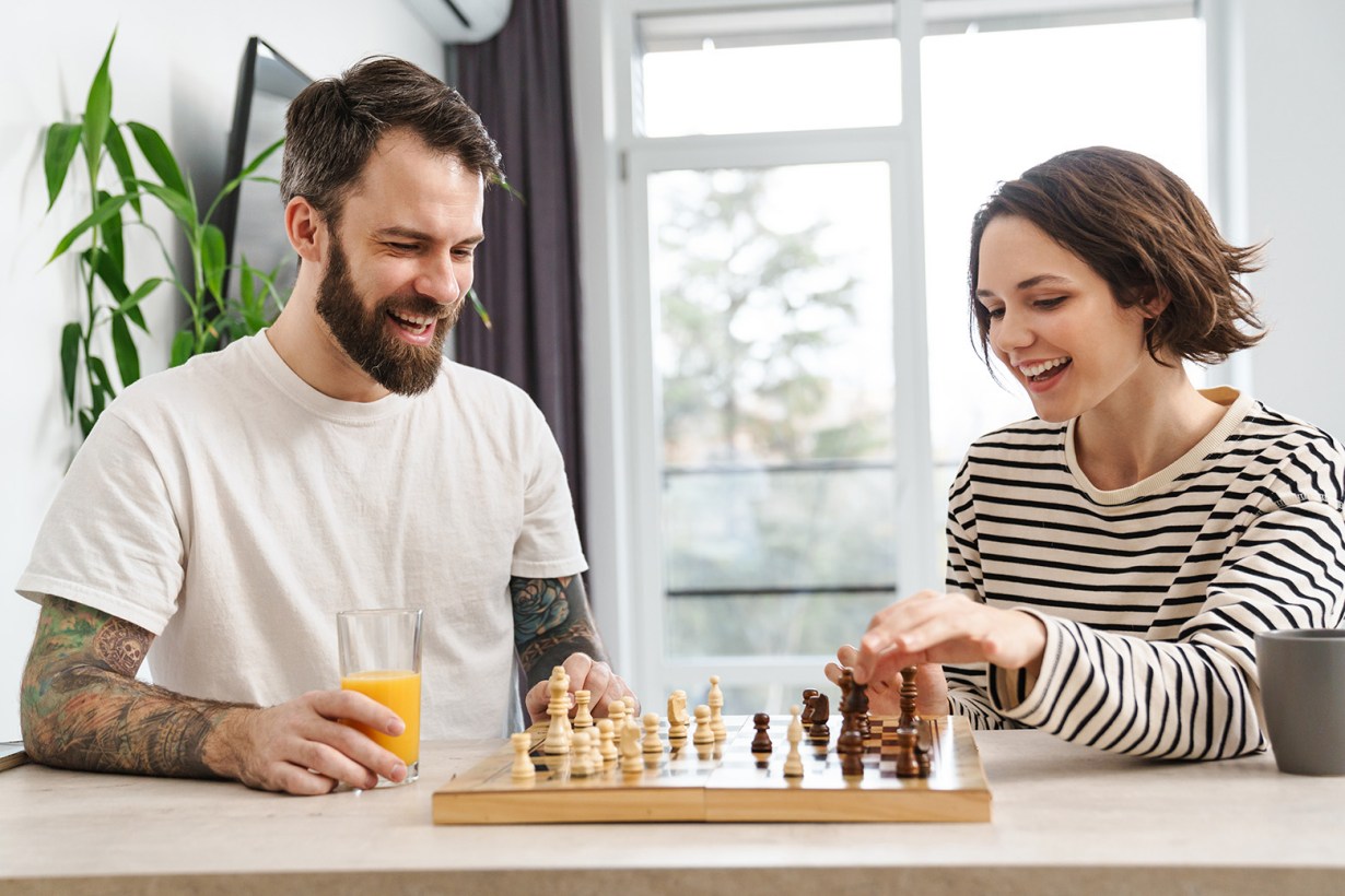 a man and a woman playing chess